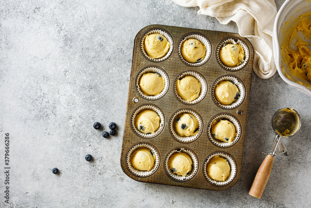 Preparing homemade blueberry muffins. Preparing homemade blueberry muffins.