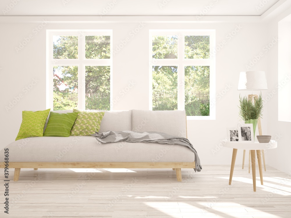 Fototapeta premium White living room with sofa and summer landscape in window. Scandinavian interior design. 3D illustration