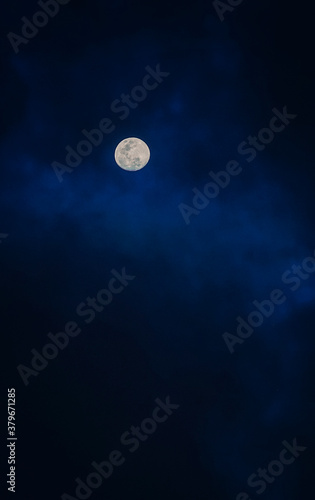 full moon over blue sky