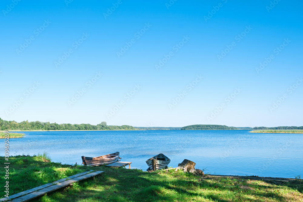 Old wooden boats on the Strusto lake. View of the third largest among the Braslav lakes. Braslav. Belarus