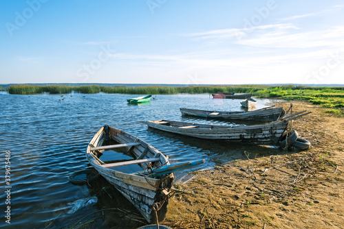 Wooden rowing fishing boats on Lake Drivyaty. Braslav lakes. Belarus photo