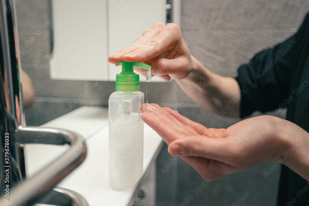 close up. man using a bactericidal hand soap.