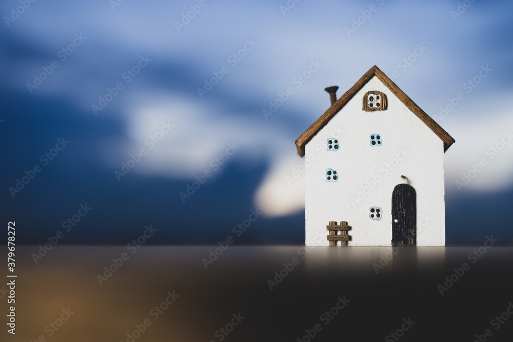 House model on wood table. Real estate agent offer house, property insurance and security, affordable housing concepts House model on wood table. Real estate agent offer house, property insurance and security, affordable housing concepts