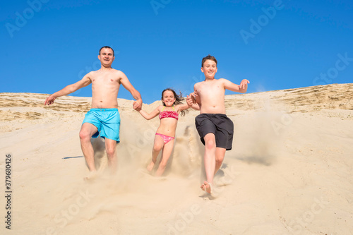 Happy family have fun playing on summer vacation. Sports, recreation, vacations. Family outdoor sports games. Healthy lifestyle.