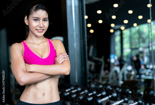 Fitness Asian woman standing for rest after exercise.