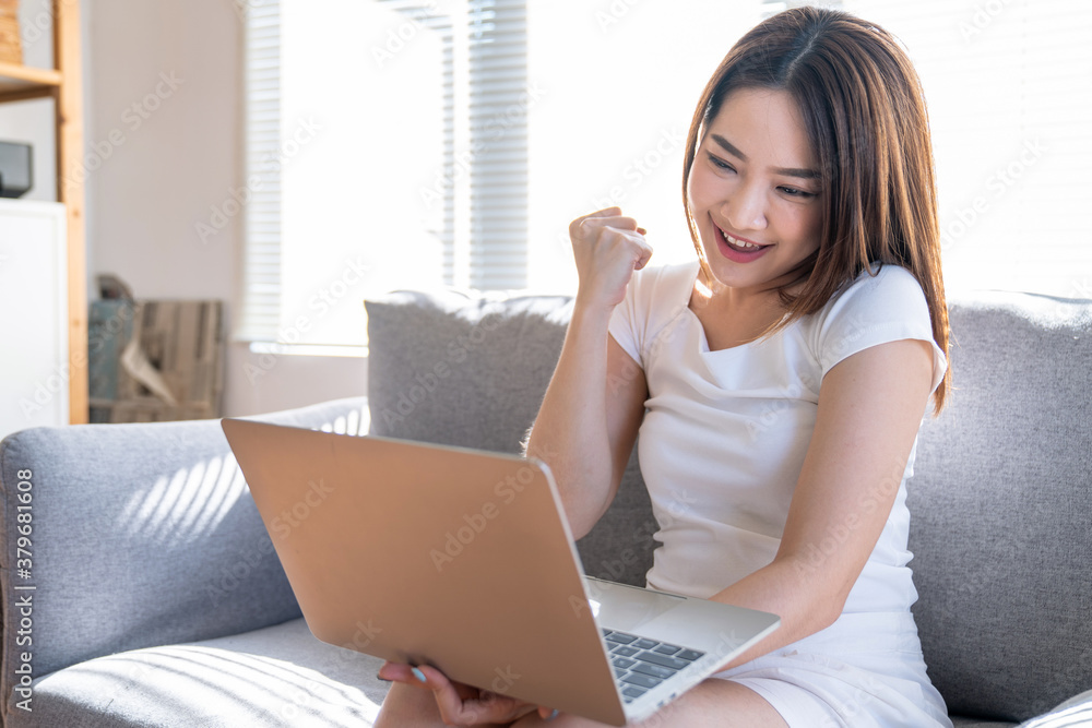 Beautiful Asian woman working on laptop computer while sitting at the home, Work from home. Beautiful Asian woman working on laptop computer while sitting at the home, Work from home.