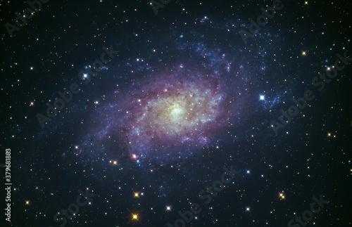 Fototapeta Naklejka Na Ścianę i Meble -  M33 the Triangulum galaxy glowing in the night sky over Cornwall, UK