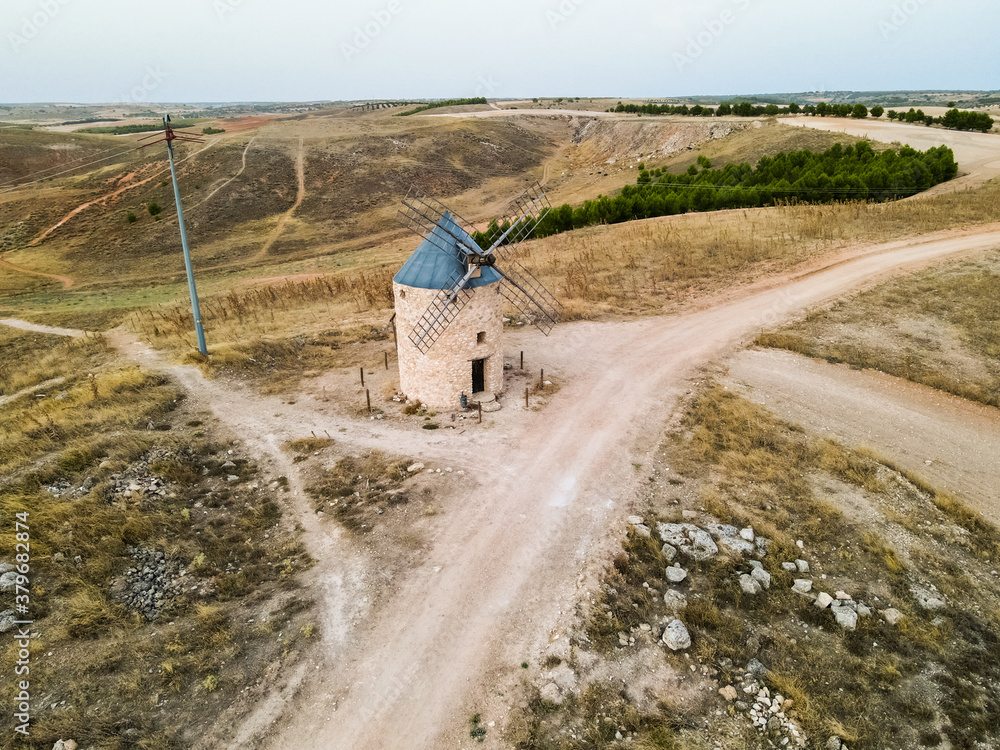 Fototapeta premium Windmills at sunset, Castile-La Mancha, Spain