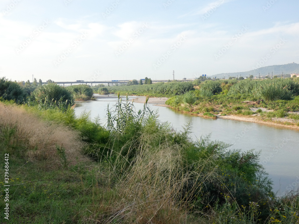 Obraz premium River Llobregat approaching the Mediterranean Sea