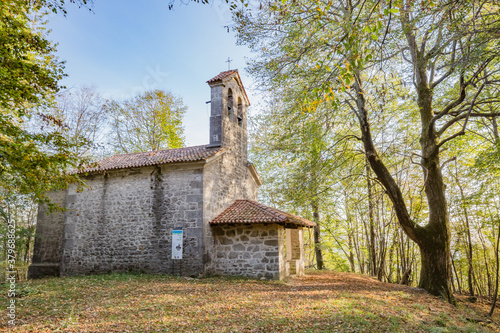 Fototapeta Naklejka Na Ścianę i Meble -  View of small cute Church of the Three Kings in the wood near Castelmonte, Prepotto, Friuli rgion, Italy