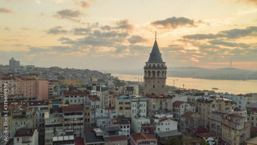 Galata Tower in Sunrise Sunlight, Aerial Hyperlapse Drone Time Lapse circle shot Galata Tower in Sunrise Sunlight, Aerial Hyperlapse Drone Time Lapse circle shot