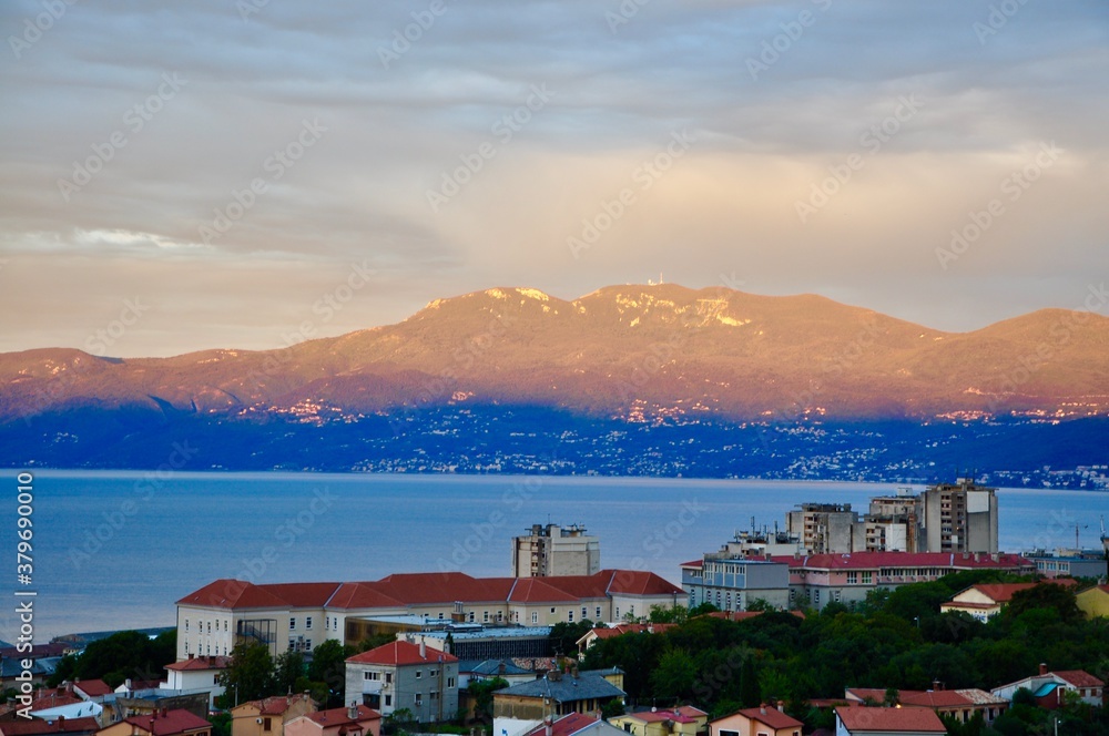 Ucka mountain near Rijeka city bathed in sun and shadows, Adriatic Sea