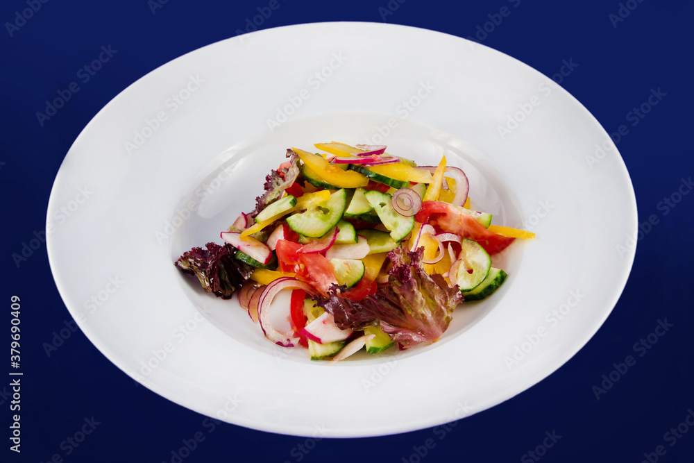 Vegetable salad with cucumbers, tomatoes, radish, radish, bell peppers, onions and lettuce. Vegetable salad with cucumbers, tomatoes, radish, radish, bell peppers, onions and lettuce.