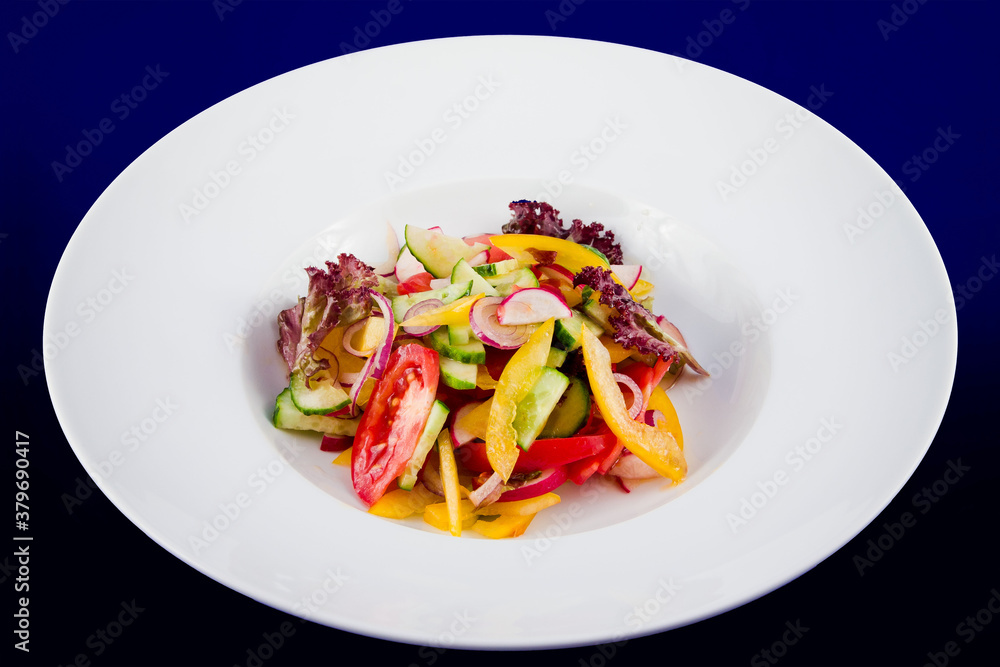 Vegetable salad with cucumbers, tomatoes, radish, radish, bell peppers, onions and lettuce. Vegetable salad with cucumbers, tomatoes, radish, radish, bell peppers, onions and lettuce.
