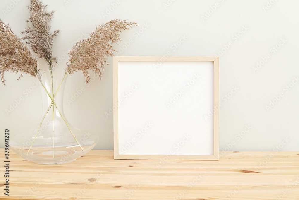 Square wooden frame mockup for photo, print, painting, artwork presentation, boho style decorations, wooden shelf. 