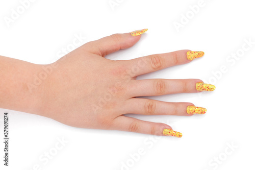 young girls hand with nailart on white photo