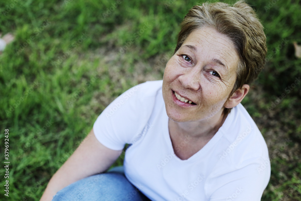 outdoor portrait of beautiful 45 years old woman outdoor portrait of beautiful 45 years old woman