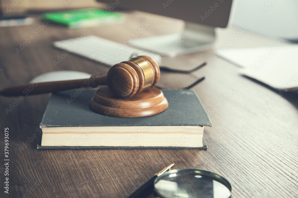 Judge gavel and book on wooden desk Judge gavel and book on wooden desk