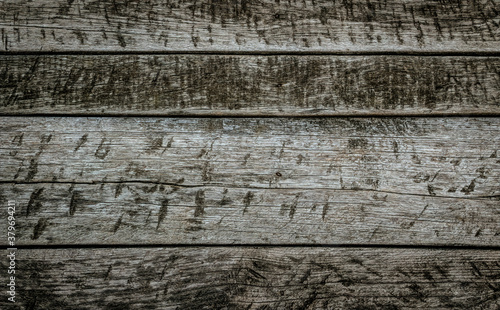 Texture of an old weathered wooden board with peeling paint. Vintage rough grunge background