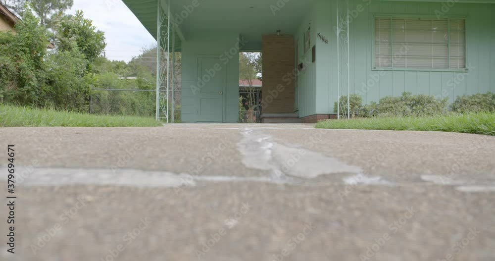 Closeup: Driveway rack focus to carport Civil rights leader Medgar Closeup: Driveway rack focus to carport Civil rights leader Medgar