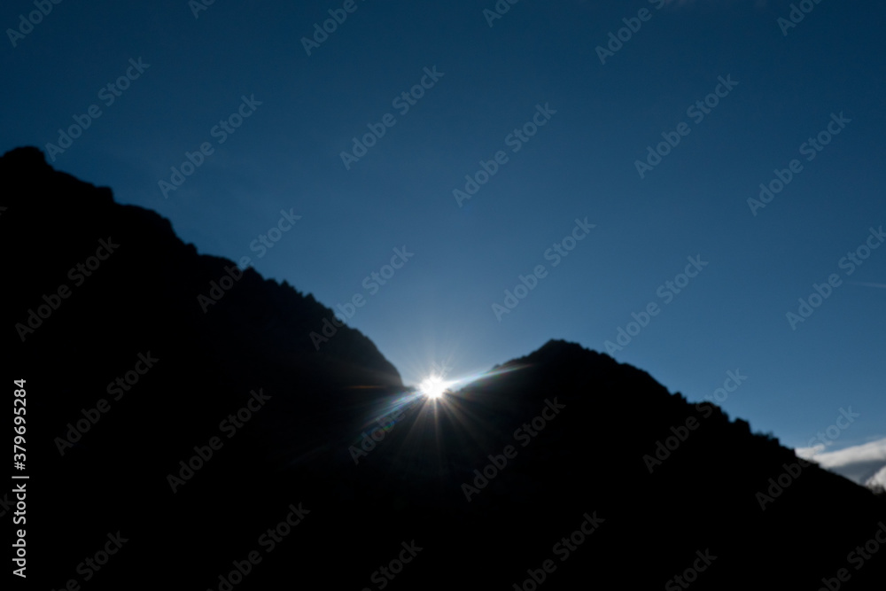 Sunrise over mountain silhouette in the Alps Sunrise over mountain silhouette in the Alps