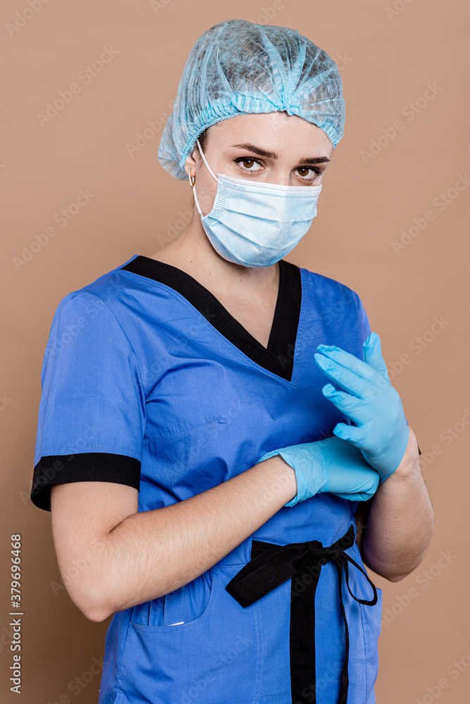 Portrait of a young doctor (isolated on brown) Portrait of a young doctor (isolated on brown)