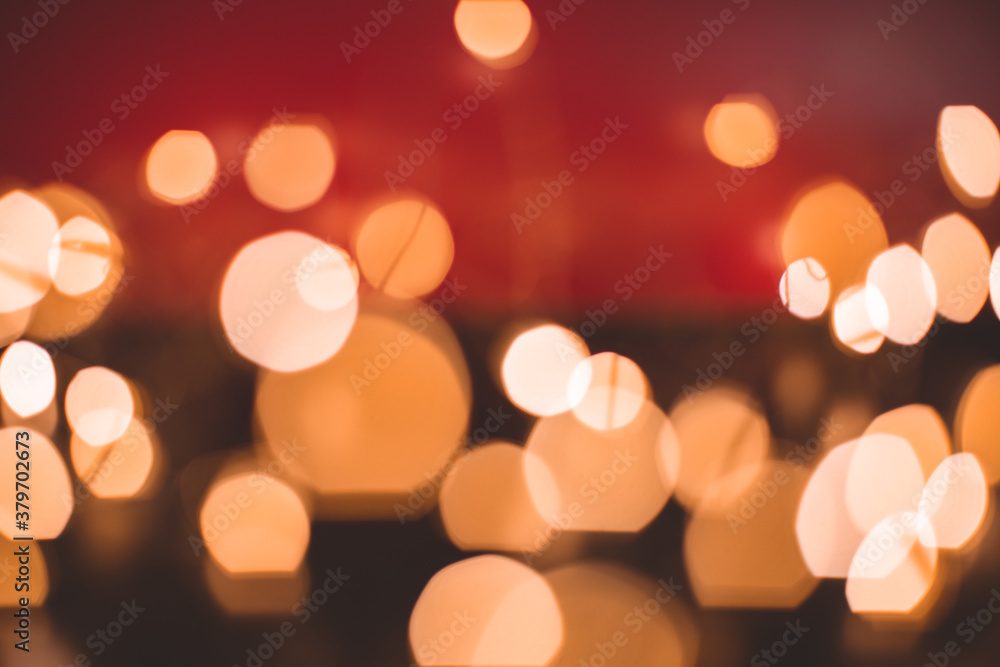Defocused abstract bokeh lights background. orange, red, black colors. christmas and new year concept Defocused abstract bokeh lights background. orange, red, black colors. christmas and new year concept