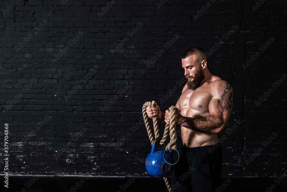 Sweatyatt Ropes Young sweaty strong muscular fit man with big muscles improvise and ...