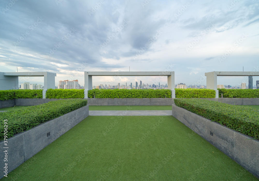 © tampatra - Sky garden on private rooftop of condominium or hotel, high rise architecture building with tree, grass field, and blue sky. © tampatra - Sky garden on private rooftop of condominium or hotel, high rise architecture building with tree, grass field, and blue sky.