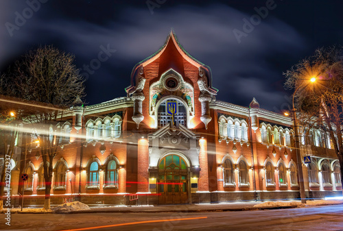 Stunning night scene of historical building of Noble and Peasant Bank in Poltava, Ukraine photo