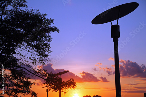 The lamp and the orange, red and purple sky