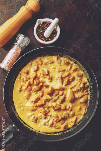 Chicken fillet cut into small pieces for frying in pan photo