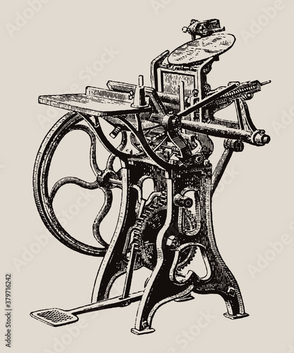 Antique foot-treadle platen printing press in three quarter view, isolated on a light brown background