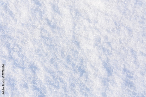 Texture of the white fluffy snow for background