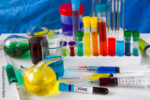 virus blood test tube in laboratory, glassware and reagents