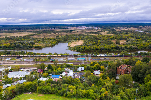 panoramic view of the motorway across the river against the backdrop of a green forest