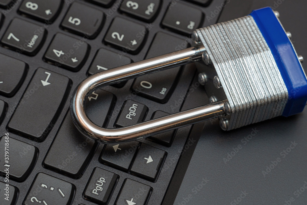 Metal lock on the black keyboard close up Metal lock on the black keyboard close up
