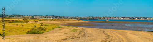 A panorama view across East Mersea flats towards Brightlingsea, UK in the summertime photo