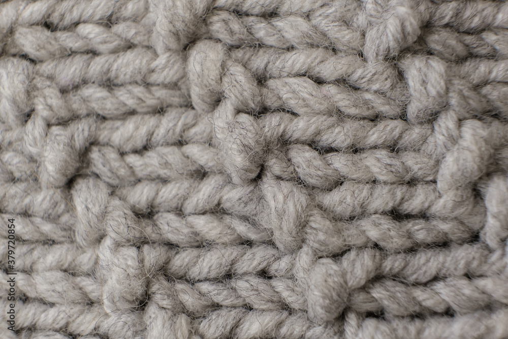 Handmade grey knitting wool texture background close up Handmade grey knitting wool texture background close up