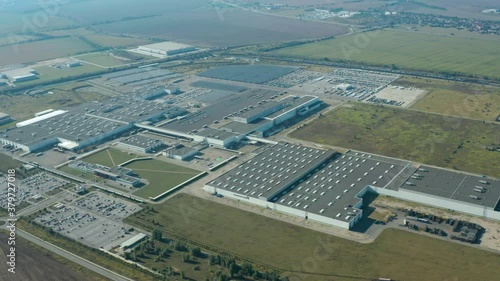 Factory on green field in europe. View from above on industrial territory and many cars nearby. White trucks on the parking zone. Aerial view.
Automotive slovakia PSA peugeot cAutomotive slovakia PSA 