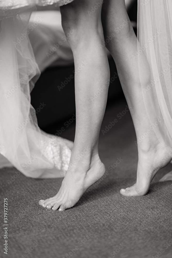 Legs of the bride. Preparation to the wedding. Bridal morning Legs of the bride. Preparation to the wedding. Bridal morning