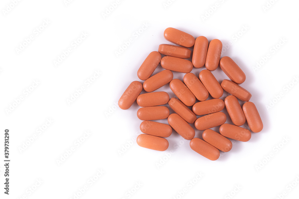 pink pills close-up on white background pink pills close-up on white background