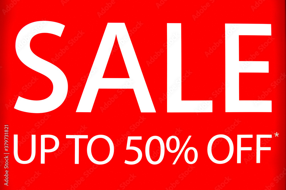 White sale inscription against red background