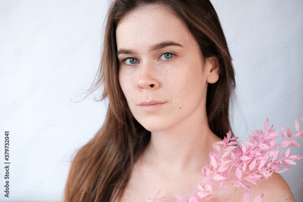 portrait of a girl in a spring mood, pink flowers