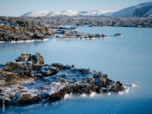 Geothermal pool of blue water surrounded by lava rocks near the Blue Lagoon, Reykjanes Iceland.