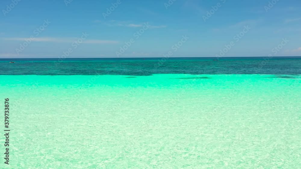 Sea water surface in lagoon with coral reef copy space for text. Top view transparent turquoise ocean water surface. Sea water surface in lagoon with coral reef copy space for text. Top view transparent turquoise ocean water surface.