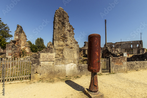 Ruined street - Oradour sur Glane, French village located in the Haute-Vienne department - martyred village victim of a massacre during the Second World War - historical ruins photo