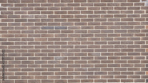 smooth brick wall of dark texture blocks with clear white seams, abstract design decorative background