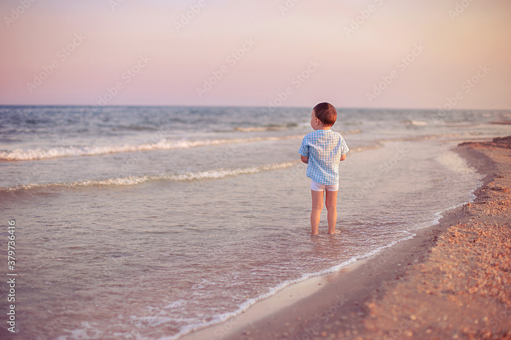 child walking on the beach