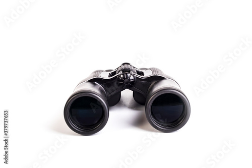 modern binoculars in black on a white background. Lenses forward. Close-up. There is no isolation